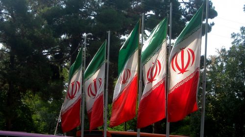 1024px-Flag_of_Iran_in_the_Nishapur_Railway_Station_square_09